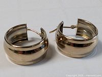 Both wide hoop earrings front view