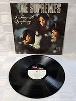 Front cover and vinyl record displayed