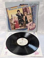 Front cover with vinyl record displayed