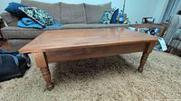 Front view of rectangular oak coffee table showing overall design and finish