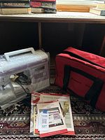 Full lot view showing machine, carry case and user guides