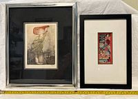 Both framed art pieces side by side on a surface showing the entire lot content.