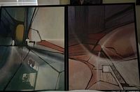 Two abstract artworks framed in black placed side by side, showing signature and geometric patterns in muted colors.