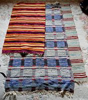 Photo showing the three woven floor runners laid out side by side displaying patterns and colors