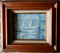 Framed impressionistic oil painting of sailboats at sea in wooden frame.