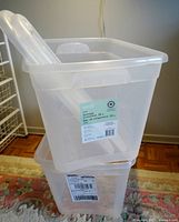 Two stacked clear plastic containers with snap-on lids and label visible showing 39 liters capacity from Type A.