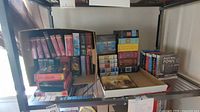 Shelf view showing multiple boxed sets and individual audio book cases including Hunger Games and assorted series.