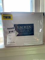 Front of packaged twin sheet set showing brand, series, and size