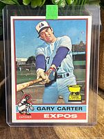 Front of baseball card featuring Gary Carter in Montreal Expos uniform with All Star Rookie Cup trophy graphic.