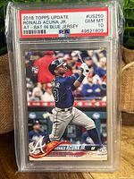 Front of 2018 Topps Update Ronald Acuna Jr. baseball card showing player batting in blue jersey, in PSA graded slab labeled Gem Mint 10.