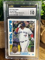 Front view of the 2019 Topps Update '84 Silver Pack rookie card of Vladimir Guerrero Jr graded Gem Mint 10 by CSG in slab.