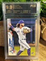 Front of the graded 2020 Bo Bichette Topps rookie card showing the player in Toronto Blue Jays uniform, with the card graded 9.0 Mint by FCG and indicating missing foil logo error.