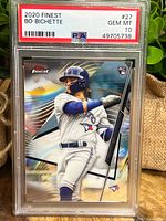 Front view of 2020 Finest Bo Bichette rookie card graded PSA 10 Gem Mint SKU #27 showing colorful background and player in batting stance.