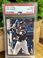 Front of the 2020 Topps Luis Robert baseball card graded PSA 10 Gem Mint, showing batting pose and team uniform.