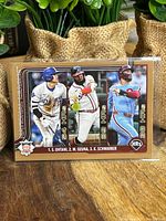 Front view showing three-player action shot (Ohtani, Ozuna, Schwarber)