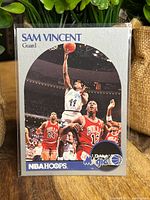 Full front of the basketball card featuring Michael Jordan wearing a #12 Chicago Bulls jersey during a game against the Orlando Magic.