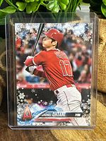 Front side of the 2018 Shohei Ohtani rookie card with holiday snowflake theme and Angels uniform.