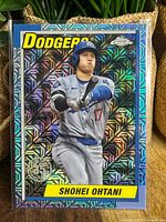 Front of Shohei Ohtani baseball card showing mojo silver holographic effect with Dodgers and Topps Chrome logos