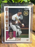 Front view of Willie Mays Topps Chrome 35th Anniversary regular card in protective sleeve showing bat poised image and inset headshot with Giants label.