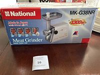 National MK-G38NR meat grinder in original box showcasing front product image and branding.