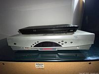 Sony BDP-BX110 BluRay player stacked on top of Scientific Atlanta CATV converter showing front panels and device condition.