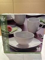 Box front and side view showing brand and set type with image of dinnerware pieces.