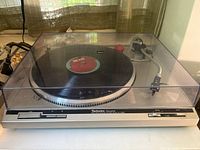 Front view of Technics SL-Q202 turntable with dust cover closed