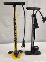 Full view of both bicycle tire pumps side-by-side showing overall condition, size, and structure.