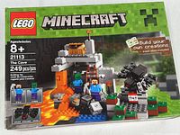 Front view of sealed Lego Minecraft set box showing age recommendation 8+, set number 21113, titled 'The Cave', and piece count 249 pcs.