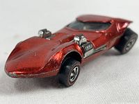 Front and side view of red Metallic Twinmill car showing twin chrome engines and condition