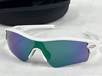 Front angle of Oakley Radar sunglasses, white frame, green-purple mirrored lens
