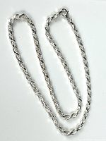Full view of the sterling silver rope chain necklace laid out flat showing the entire length and clasp.