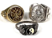 Three sterling silver rings displayed together showing the different styles and designs.