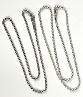 Two silver rope chains laid flat on a white background, showing overall length and shape.