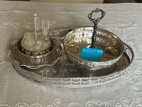 Group shot showing all trays, cruet set and condiment server