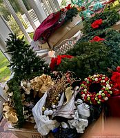 Overview of lot showing faux tree, wreaths, garlands, bows, decorative picks and ornaments