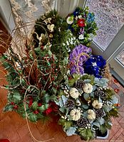 Top view of full lot showing wreaths, arrangements, ornaments and ribbon
