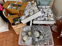 overview of ornament boxes, wreath box and tote with silver decorations