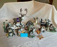 Group shot of all figurines and glass butterfly