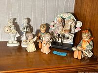 All seven figurines with carousel music box on shelf