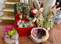 Group shot showing tote, bunny figures, egg trees, ribbons, bag of eggs