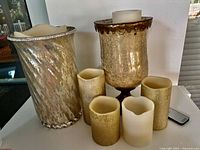 Both mercury glass candle holders, four electronic candles, remote visible