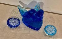 Bluebird figurine with two Murano paperweights front view
