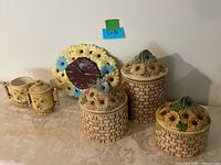 Group view of all daisy motif ceramic items