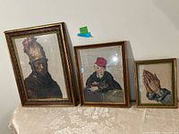 Group shot of all three framed needlepoints