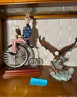 Both Lenox figurines on shelf