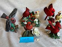Group shot of six porcelain bird figurines with lot tag