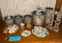 Full lot showing figurines, candle holders and boxes on shelf