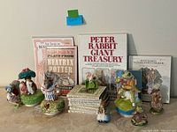 Full lot showing figurines, music boxes, books and calendar