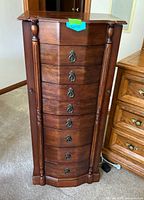 Front view of armoire showing drawers and overall design